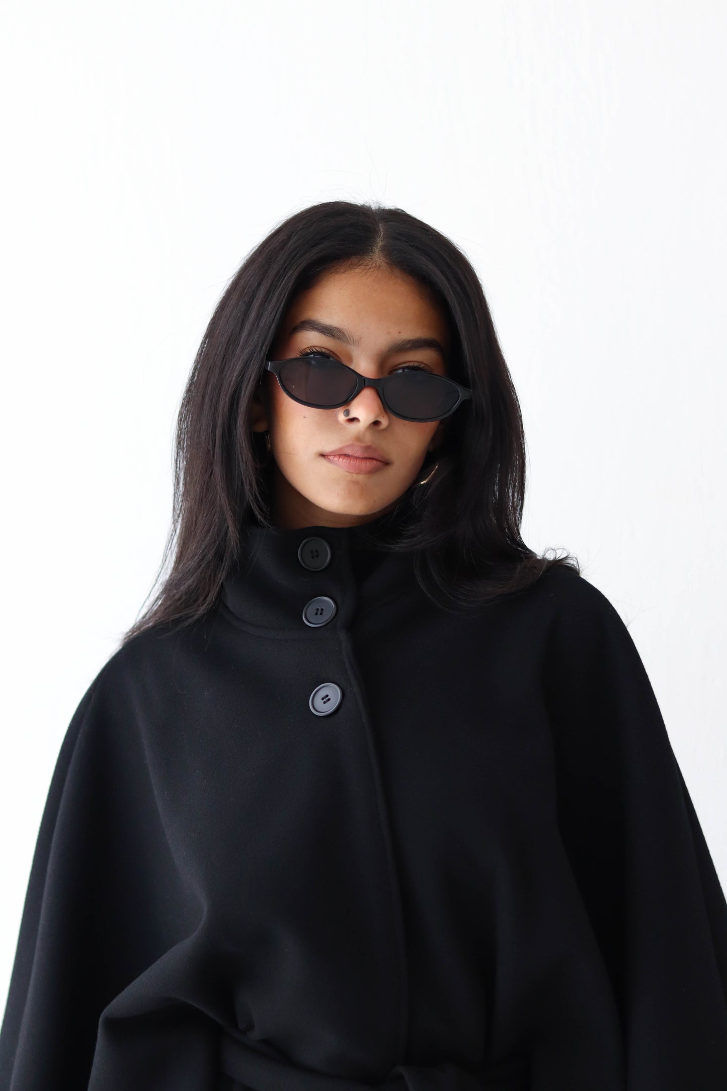 Belted wool cape in Black